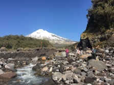 Taranaki photobombing a nice picture of some geologists.