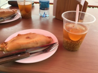 Another empanada, along with some "mote con huesillo", a non-alcoholic sweet drink with a dried peach and wheat in it.